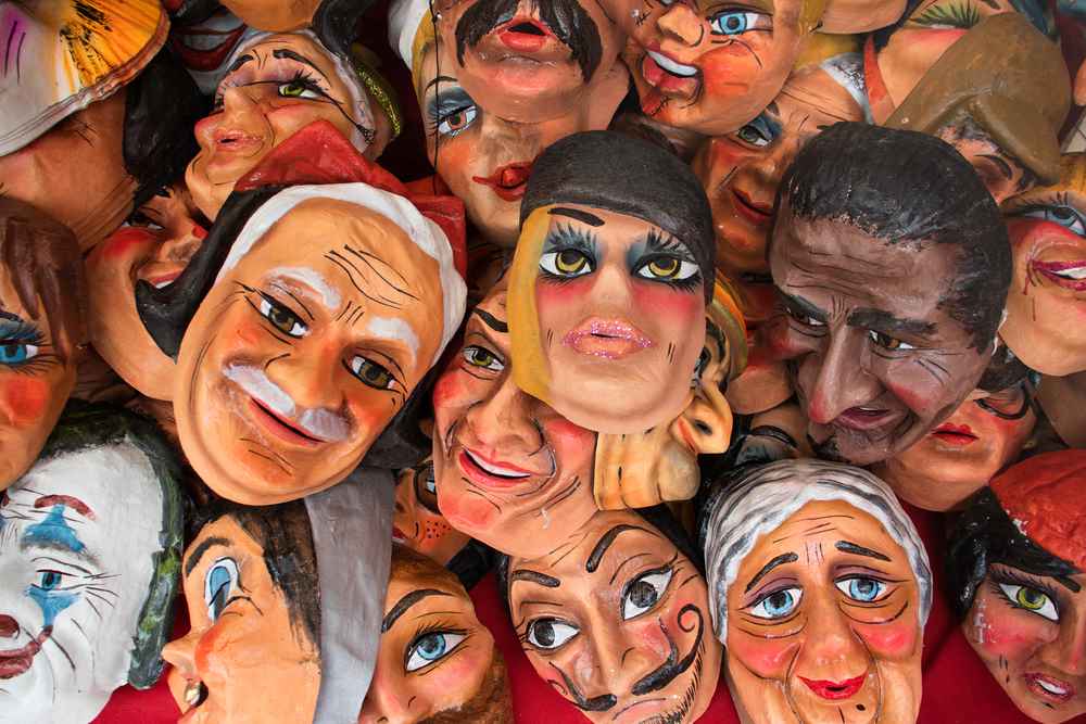 Colorful masks for sale in Cuenca, Ecuador, featuring 411 Business Law, highlighting Integrating Corporate Cultures and Operations, and aligning with the page's context.