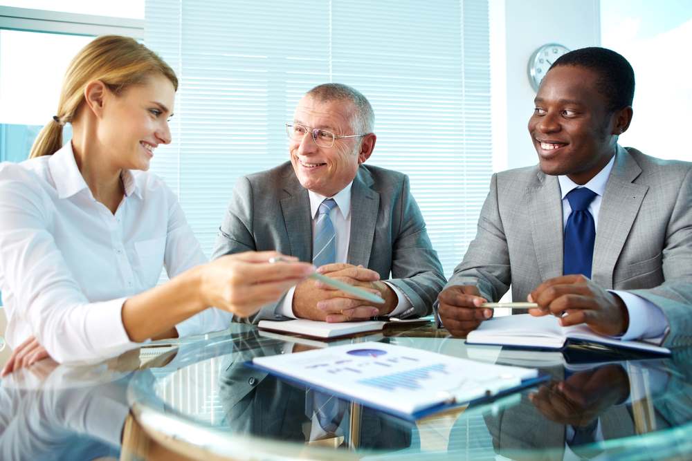 Image of a paper discussion scene, featuring 411 Business Law and highlighting 'Regulatory Compliance Consultants,' ensuring it aligns with the page's context.